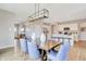 Dining room with modern decor, hardwood floors, natural light, and open concept at 16930 Sandhurst Pl, Westfield, IN 46074