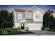 Charming two-story home with gray siding, white trim, and a welcoming two-car garage at 16930 Sandhurst Pl, Westfield, IN 46074