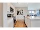 Contemporary kitchen featuring stainless steel appliances, white cabinets, and an open layout to the living area at 16930 Sandhurst Pl, Westfield, IN 46074