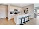 Stylish kitchen with white cabinets, stainless steel appliances, and a center island with four stools at 16930 Sandhurst Pl, Westfield, IN 46074