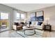 Bright living room featuring modern decor, wood flooring and a sliding glass door at 16930 Sandhurst Pl, Westfield, IN 46074
