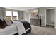 Bright bedroom featuring a large window, neutral colors, and modern furnishings at 17001 Fulsam St, Westfield, IN 46074