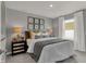 Comfortable bedroom featuring large window, plush bedding, and stylish bedside tables at 17001 Fulsam St, Westfield, IN 46074