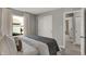 Bright bedroom with large window, slider closet doors, and a comfortable bed with decorative pillows at 17001 Fulsam St, Westfield, IN 46074