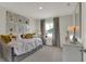 Bright bedroom showcasing a daybed with decorative pillows and an array of framed animal art at 17001 Fulsam St, Westfield, IN 46074