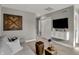 Cozy living room with modern gray decor, TV, and unique wood accent wall at 17001 Fulsam St, Westfield, IN 46074