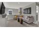 Bright living space with comfortable seating, neutral tones, and a welcoming atmosphere at 17001 Fulsam St, Westfield, IN 46074