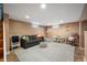 Finished basement area with a gray sofa, play area, rug, and a cozy, inviting atmosphere at 171 W 44Th St, Indianapolis, IN 46208