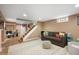 Finished basement with a gray sofa, neutral rug, and ample space for recreation and relaxation at 171 W 44Th St, Indianapolis, IN 46208