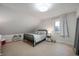 Charming bedroom with a patterned bed frame and a white bookshelf for stylish organization at 171 W 44Th St, Indianapolis, IN 46208