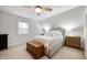 Comfortable bedroom with neutral decor and plenty of natural light, features an elegant, cozy queen size bed at 171 W 44Th St, Indianapolis, IN 46208