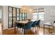 Inviting dining room with modern lighting, stylish decor, and hardwood floors at 171 W 44Th St, Indianapolis, IN 46208