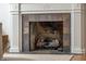 Close-up view of a fireplace with stone surround and decorative mantle at 171 W 44Th St, Indianapolis, IN 46208