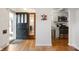 Foyer with a view of the kitchen, hardwood floors, and modern decor at 171 W 44Th St, Indianapolis, IN 46208