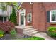 Charming brick home with a well-maintained front yard and inviting entrance at 171 W 44Th St, Indianapolis, IN 46208