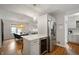 This kitchen features stainless steel appliances, white cabinets, and a center island with bar seating at 171 W 44Th St, Indianapolis, IN 46208