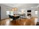 Open living space featuring dining area and living room with hardwood floors and stylish lighting at 171 W 44Th St, Indianapolis, IN 46208