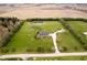 Aerial view of a well maintained country estate with a pond and mature manicured landscaping at 180 S 400 W, Lebanon, IN 46052