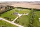 Expansive property featuring a home, outbuilding, pond, and surrounding farmland at 180 S 400 W, Lebanon, IN 46052