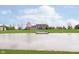 Backyard featuring a serene pond, dock and a well-maintained lawn at 180 S 400 W, Lebanon, IN 46052