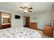 Bedroom featuring a ceiling fan, TV, closet, and ensuite bathroom at 180 S 400 W, Lebanon, IN 46052