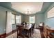 Formal dining room with an elegant chandelier, large windows, and hardwood floors at 180 S 400 W, Lebanon, IN 46052