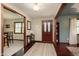 Inviting foyer with hardwood floors, dark wood trim, and natural light streaming through windows at 180 S 400 W, Lebanon, IN 46052