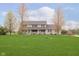 Charming two-story home with a well-manicured lawn, covered porch, and vibrant landscaping at 180 S 400 W, Lebanon, IN 46052