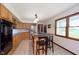 Open kitchen with a center island, stainless steel appliances, and light wood cabinetry at 180 S 400 W, Lebanon, IN 46052