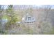 Unique home with a deck among the trees, offering privacy and a secluded feel at 1907 N Washington St, Danville, IN 46122