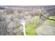 Aerial shot of property with mature trees and a home situated on a spacious lot, perfect for outdoor living at 1907 N Washington St, Danville, IN 46122