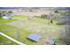 Stunning aerial view showcasing a unique cloverleaf design in a green field, ideal for a farm or recreational space at 1907 N Washington St, Danville, IN 46122