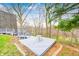 Scenic backyard featuring multi-level deck spaces nestled among blooming trees and greenery at 1907 N Washington St, Danville, IN 46122