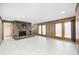 Large basement featuring tile floors, a brick fireplace, and access to the outdoors at 1907 N Washington St, Danville, IN 46122