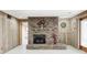 Finished basement with brick fireplace and wood-paneled walls at 1907 N Washington St, Danville, IN 46122