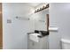 Well-lit bathroom featuring a modern vanity with black countertop and stylish mirror at 1907 N Washington St, Danville, IN 46122