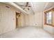 Spacious carpeted bedroom with a ceiling fan and window at 1907 N Washington St, Danville, IN 46122