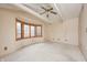 Large bedroom featuring a bay window and neutral carpet at 1907 N Washington St, Danville, IN 46122