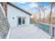 Exterior view of a home with a spacious deck, offering stunning views of the natural surroundings at 1907 N Washington St, Danville, IN 46122