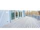 Expansive deck area with multiple access doors, perfect for outdoor living and entertaining at 1907 N Washington St, Danville, IN 46122