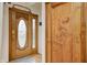 Inviting foyer featuring custom wood doors with decorative glass and carved details at 1907 N Washington St, Danville, IN 46122