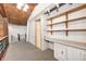 Hallway offering wood beam ceilings and built-in shelving at 1907 N Washington St, Danville, IN 46122