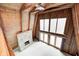Bright living room with a stone fireplace and large windows for natural light at 1907 N Washington St, Danville, IN 46122
