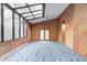 Bright living room with floor to ceiling windows and natural wood paneling at 1907 N Washington St, Danville, IN 46122