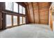 Bright living room with floor-to-ceiling windows, wood accents, and ample natural light at 1907 N Washington St, Danville, IN 46122
