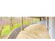 Expansive covered patio with views of lush greenery, perfect for outdoor relaxation and entertaining near the home at 1907 N Washington St, Danville, IN 46122