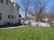 Spacious backyard with well-maintained lawn and pergola at 210 E Monroe St, Alexandria, IN 46001
