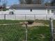 Backyard featuring a fire pit area, green grass and a privacy fence surrounding the property at 210 E Monroe St, Alexandria, IN 46001