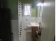 Bathroom featuring a sink vanity, toilet, and shower/tub combination at 210 E Monroe St, Alexandria, IN 46001