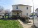 View of home exterior featuring fenced yard, covered porch and private backyard at 210 E Monroe St, Alexandria, IN 46001